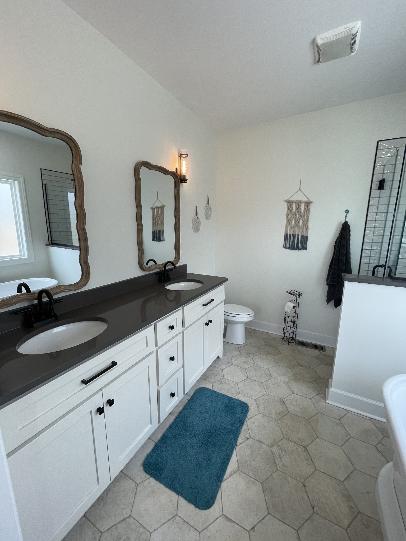 136 Dunn Fall River Road Leoma, TN 38468 - Photo 17 of 25 a spacious bathroom with a double vanity sink and a mirror