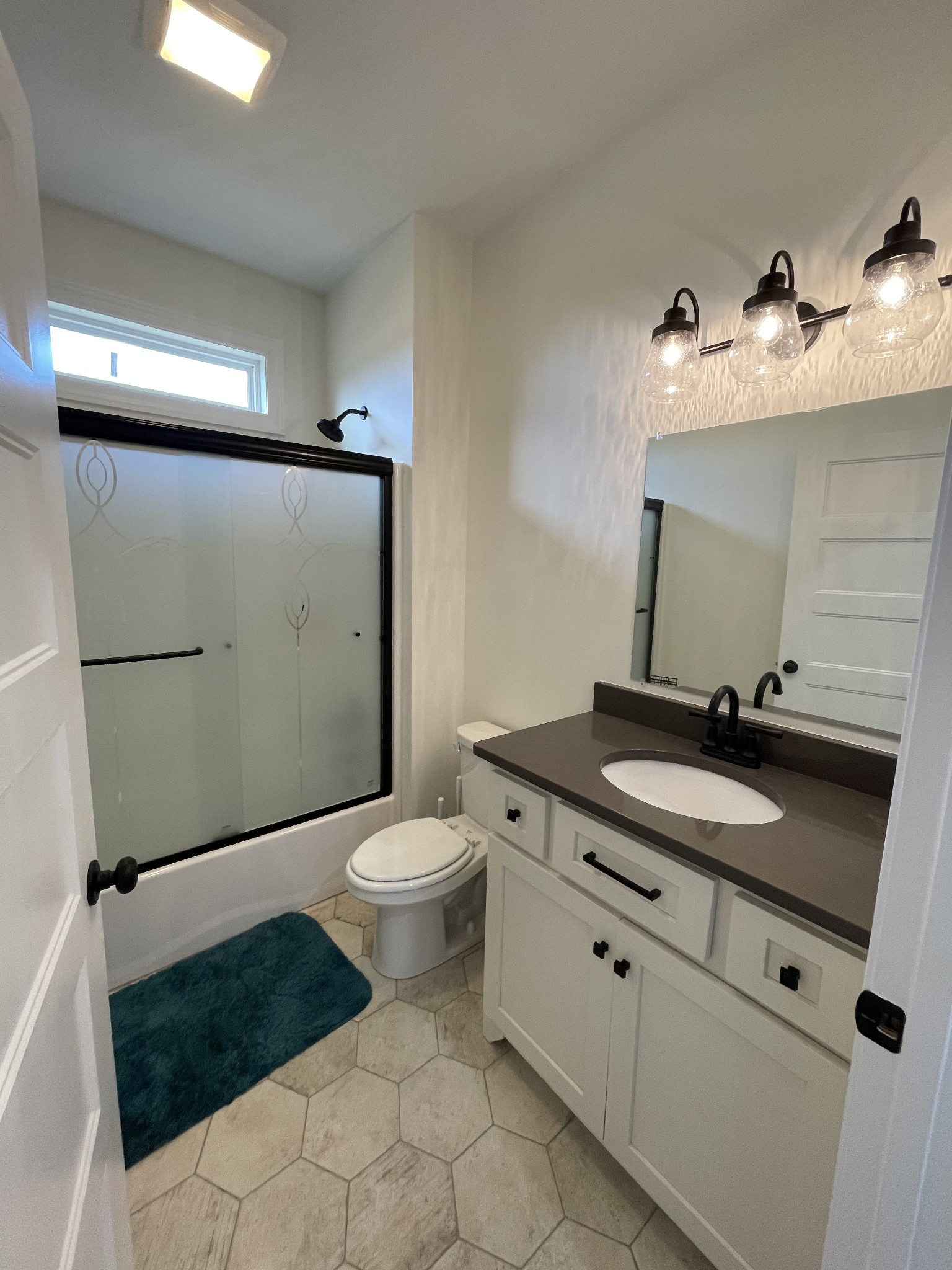136 Dunn Fall River Road Leoma, TN 38468 - Photo 21 of 25 a bathroom with a granite countertop sink toilet and mirror