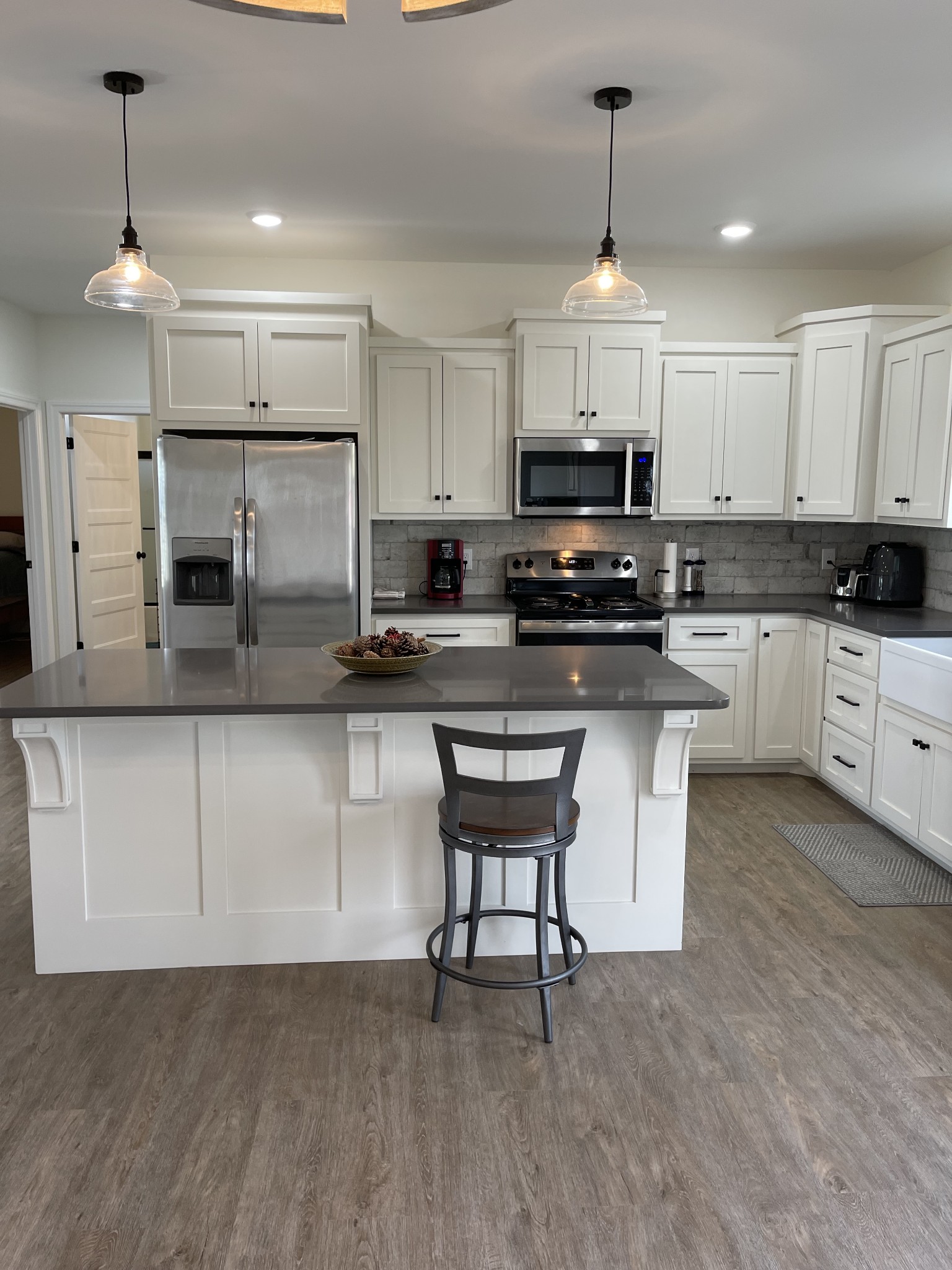 136 Dunn Fall River Road Leoma, TN 38468 - Photo 9 of 25 a kitchen with stainless steel appliances granite countertop a stove top oven a sink dishwasher and a refrigerator