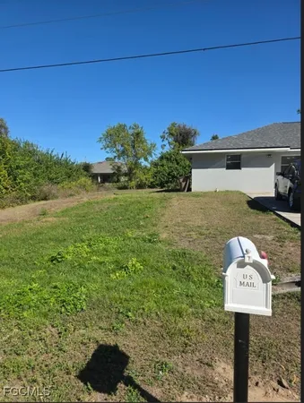 a view of a yard with an outdoor space