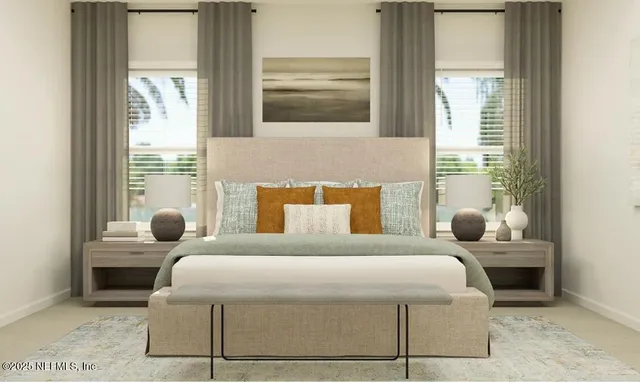 a bedroom with a large bed and a window