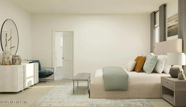 a bedroom with a couch and a table