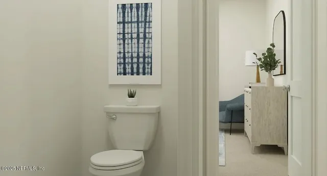 a bathroom with a toilet and a sink