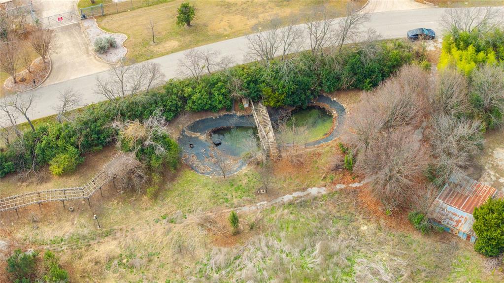 382 Dublin Road Parker, TX 75094 - Photo 8 of 25 a backyard of a house with a yard and plants
