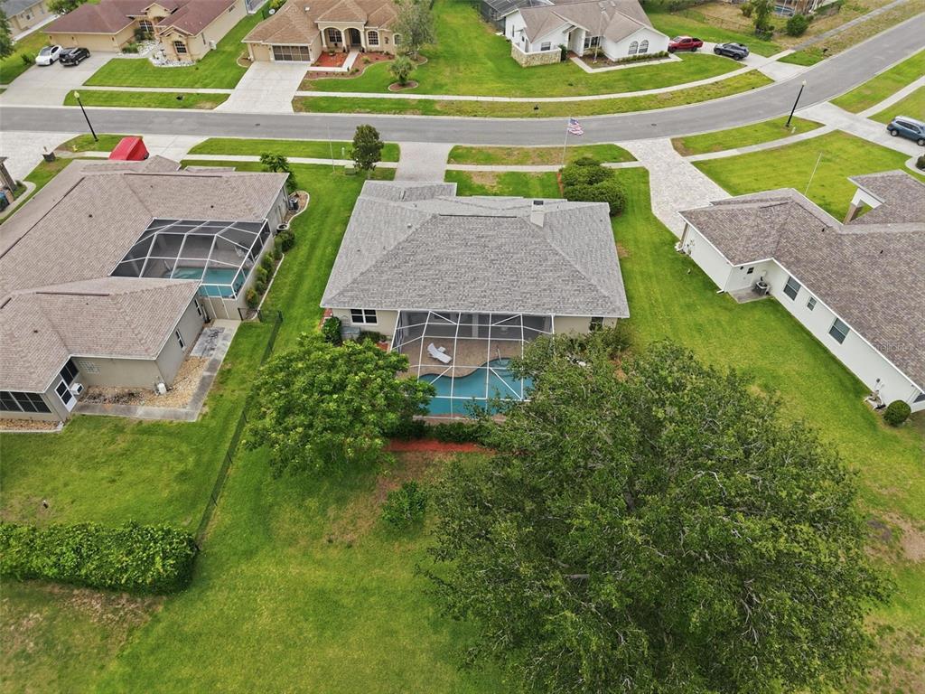 14228 Presteign Lane Spring Hill, FL 34609 - Photo 83 of 89 an aerial view of a house with a yard basket ball court and outdoor seating