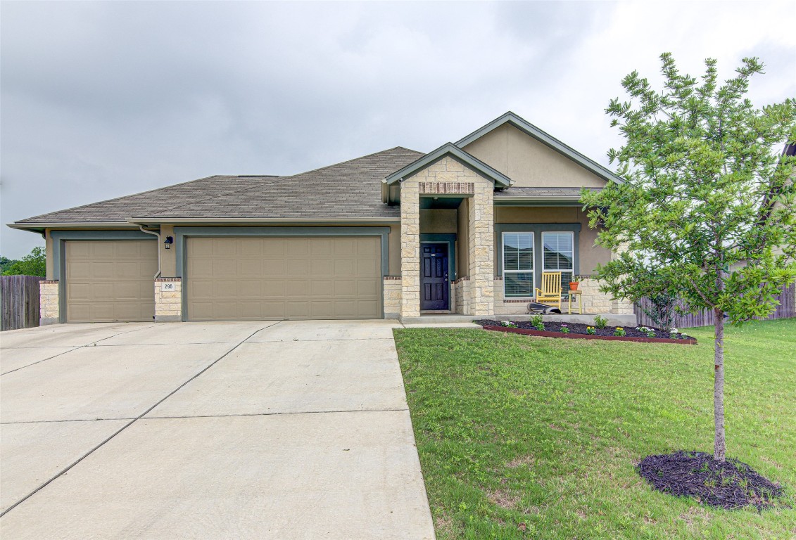 296 Silver Spgs Bend Kyle, TX 78640 - Photo 1 of 1 a front view of a house with a yard and porch