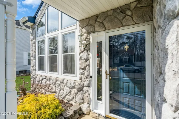 a front view of a house with a glass door