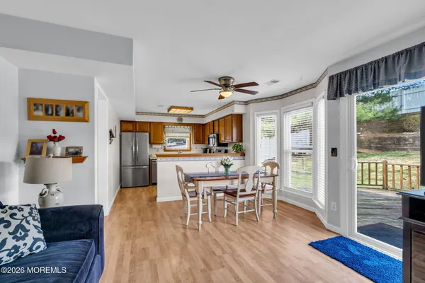 a view of a dining room with furniture window and wooden floor