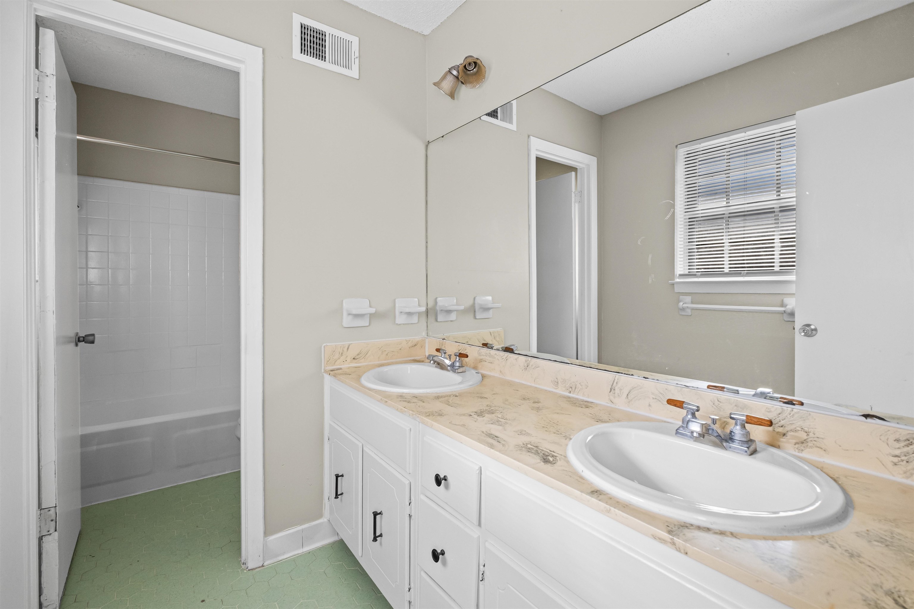 4982 Holly Ridge Drive Memphis, TN 38118 - Photo 15 of 26 a bathroom with a sink and a mirror