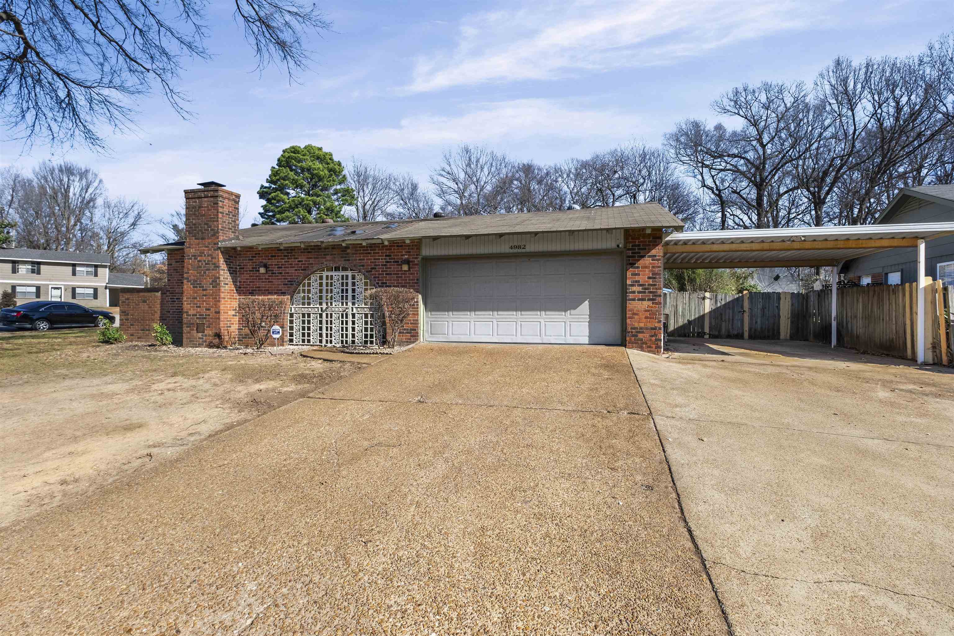 4982 Holly Ridge Drive Memphis, TN 38118 - Photo 2 of 26 a view of a house with a outdoor space