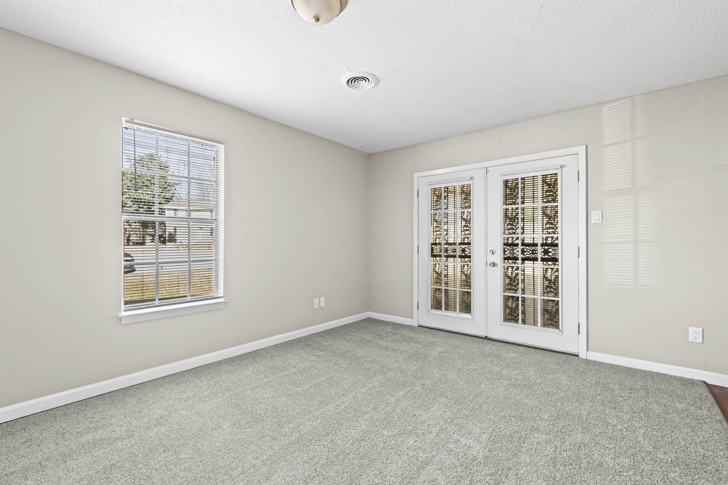 4982 Holly Ridge Drive Memphis, TN 38118 - Photo 5 of 26 an empty room with windows