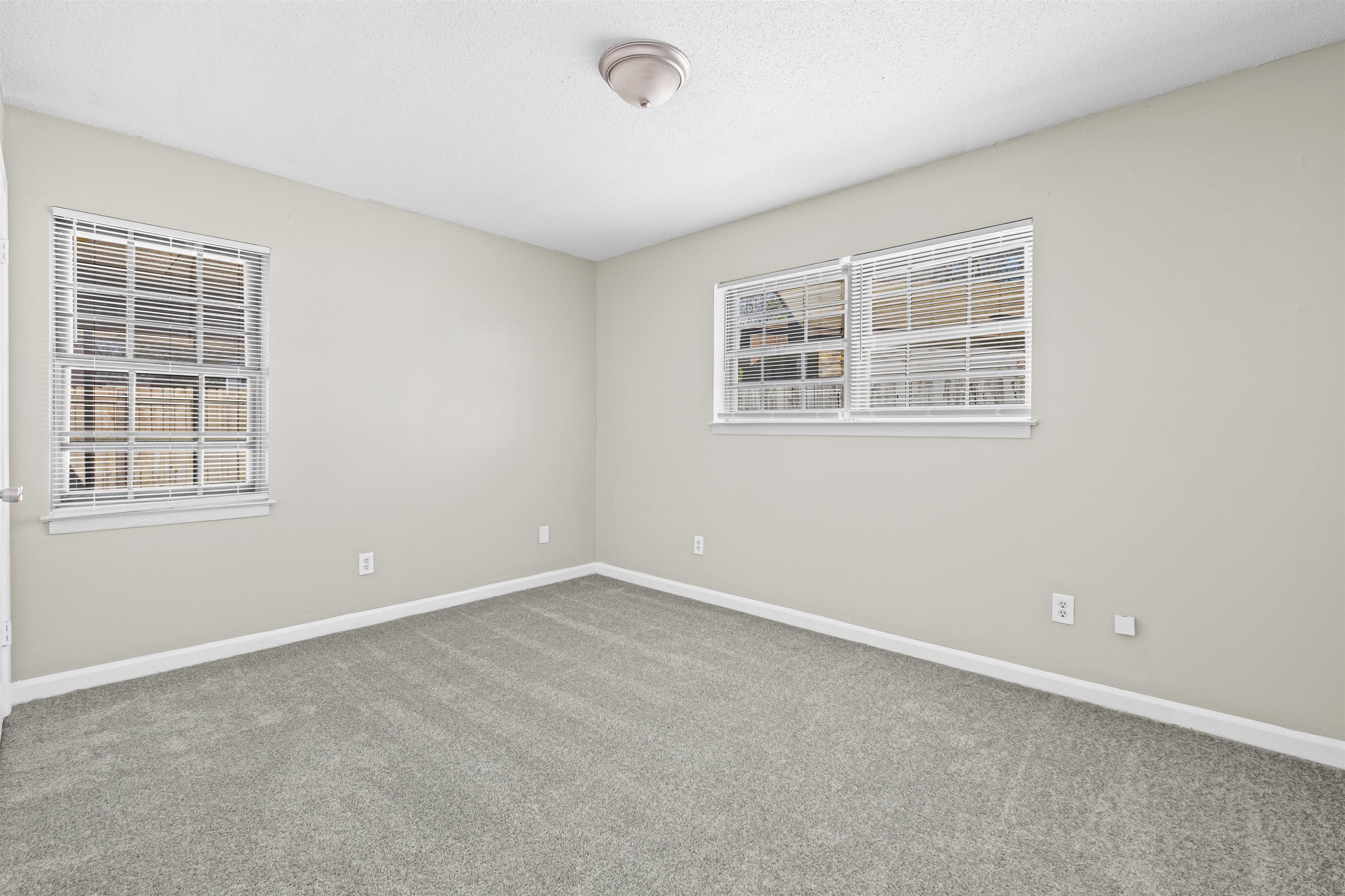 4982 Holly Ridge Drive Memphis, TN 38118 - Photo 9 of 26 an empty room with windows