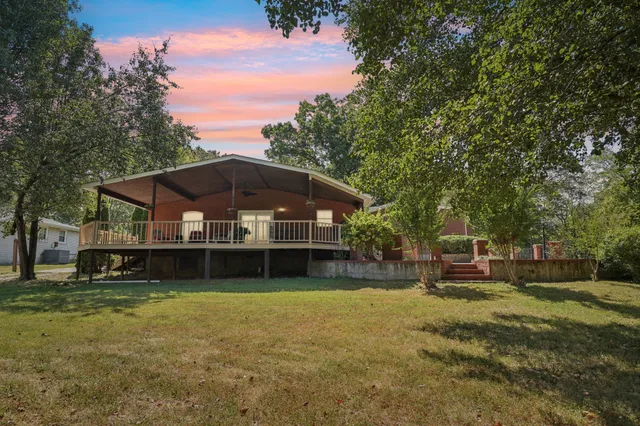 a view of a balcony with couch and wooden floor