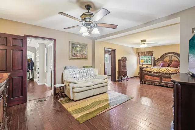 a view of a dining room with furniture wooden floor and chandelier