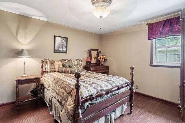 a view of balcony with wooden floor and fence