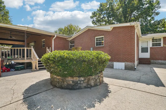 a bathroom with a sink mirror and a toilet