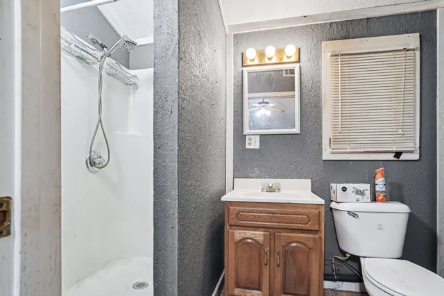 an aerial view of a house with garden space and lake view