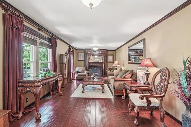 a view of a dining room with furniture wooden floor and chandelier