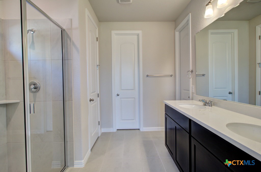 2129 Shepards Street Seguin, TX 78155 - Photo 17 of 29 a bathroom with a sink and a mirror