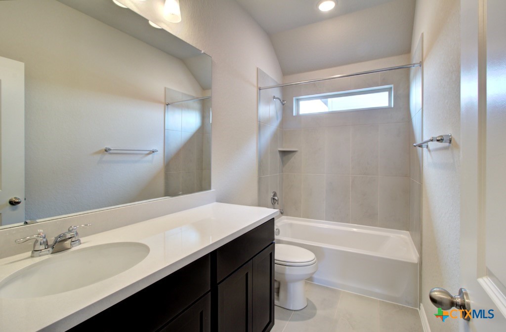 2129 Shepards Street Seguin, TX 78155 - Photo 27 of 29 a bathroom with a sink a toilet and shower