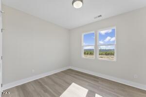 2760 River Meadow Spring Hope, NC 27882 - Photo 35 of 42 an empty room with a window