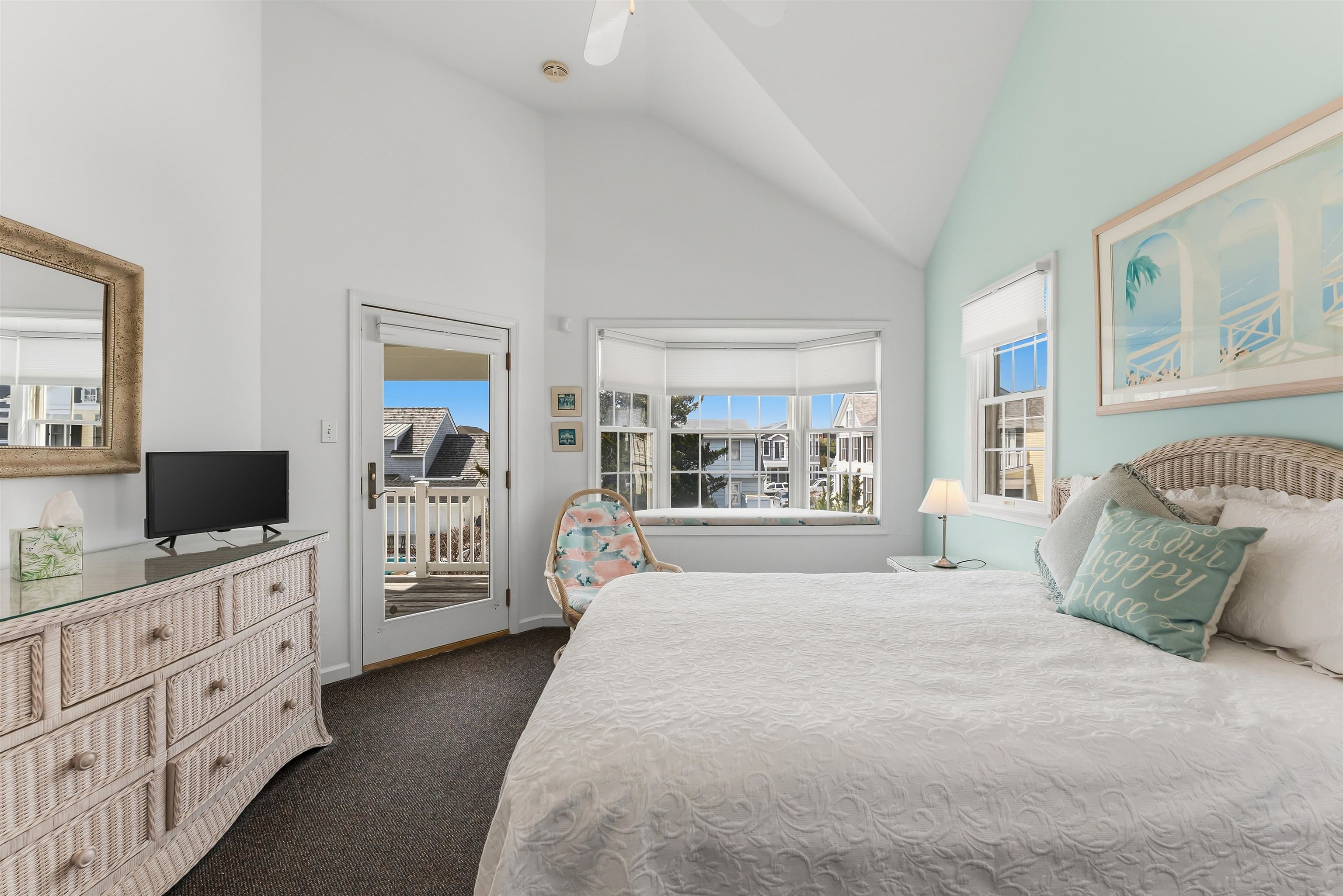 125 98th Street Stone Harbor, NJ 08247 - Photo 17 of 42 a spacious bedroom with a bed and a flat screen tv
