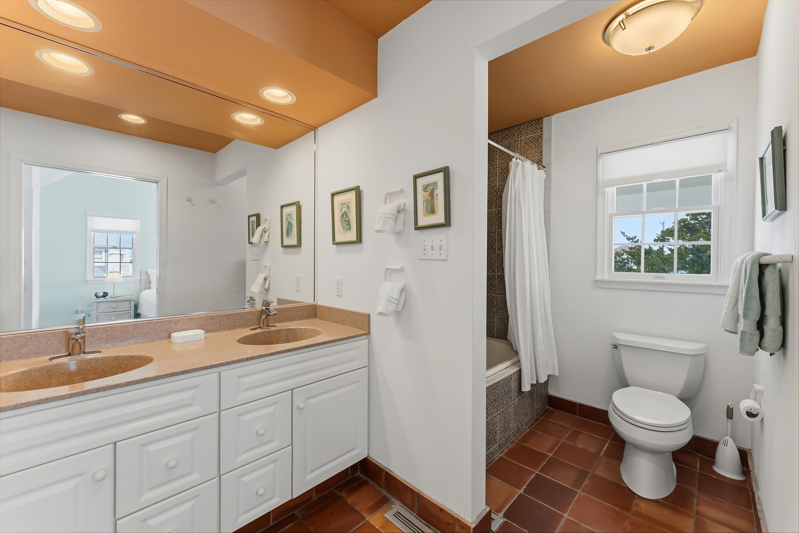 125 98th Street Stone Harbor, NJ 08247 - Photo 19 of 42 a spacious bathroom with a toilet sink and mirror