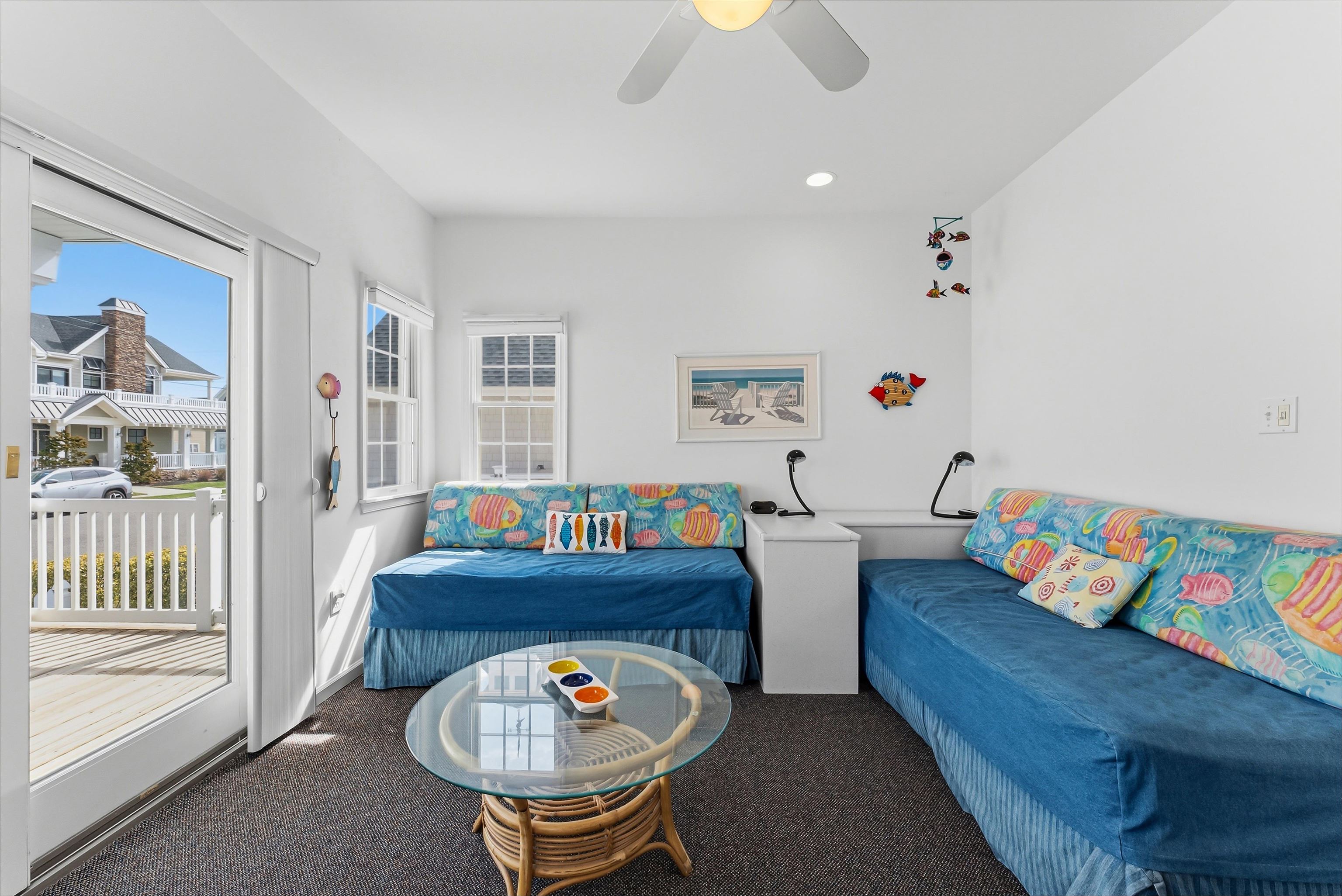 125 98th Street Stone Harbor, NJ 08247 - Photo 23 of 42 a living room with furniture and a table