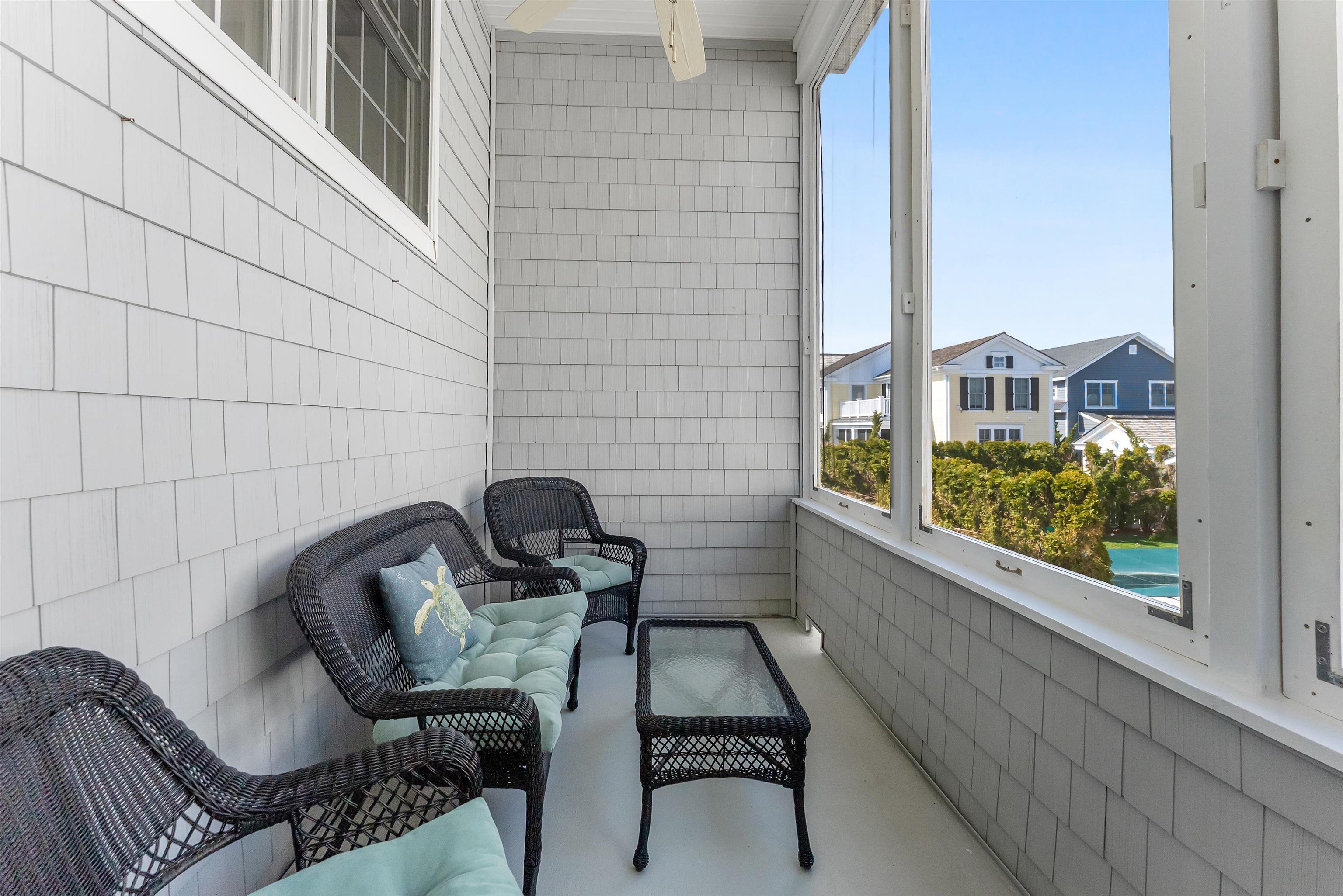 125 98th Street Stone Harbor, NJ 08247 - Photo 27 of 42 a view of a balcony with chair and table