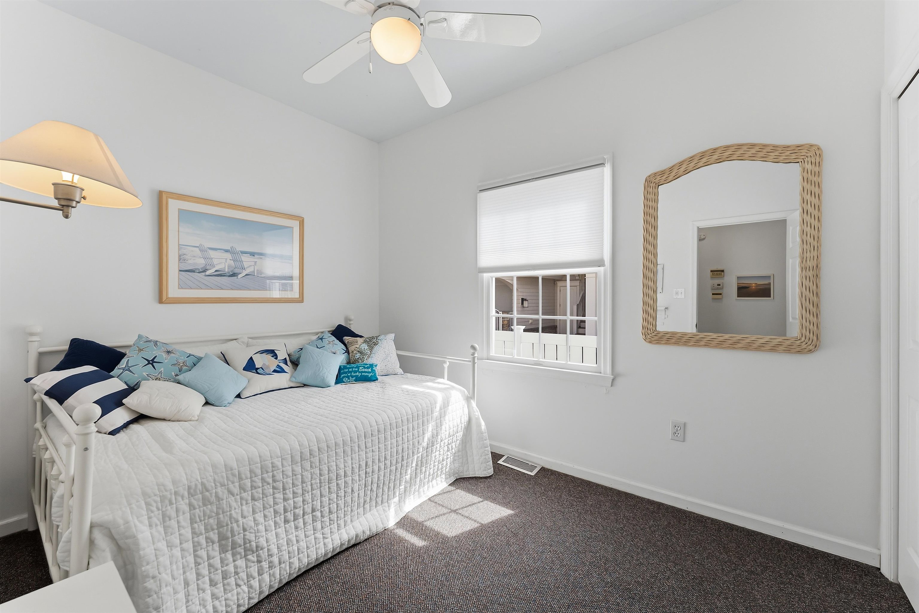 125 98th Street Stone Harbor, NJ 08247 - Photo 29 of 42 a bedroom with a bed and a painting on the wall