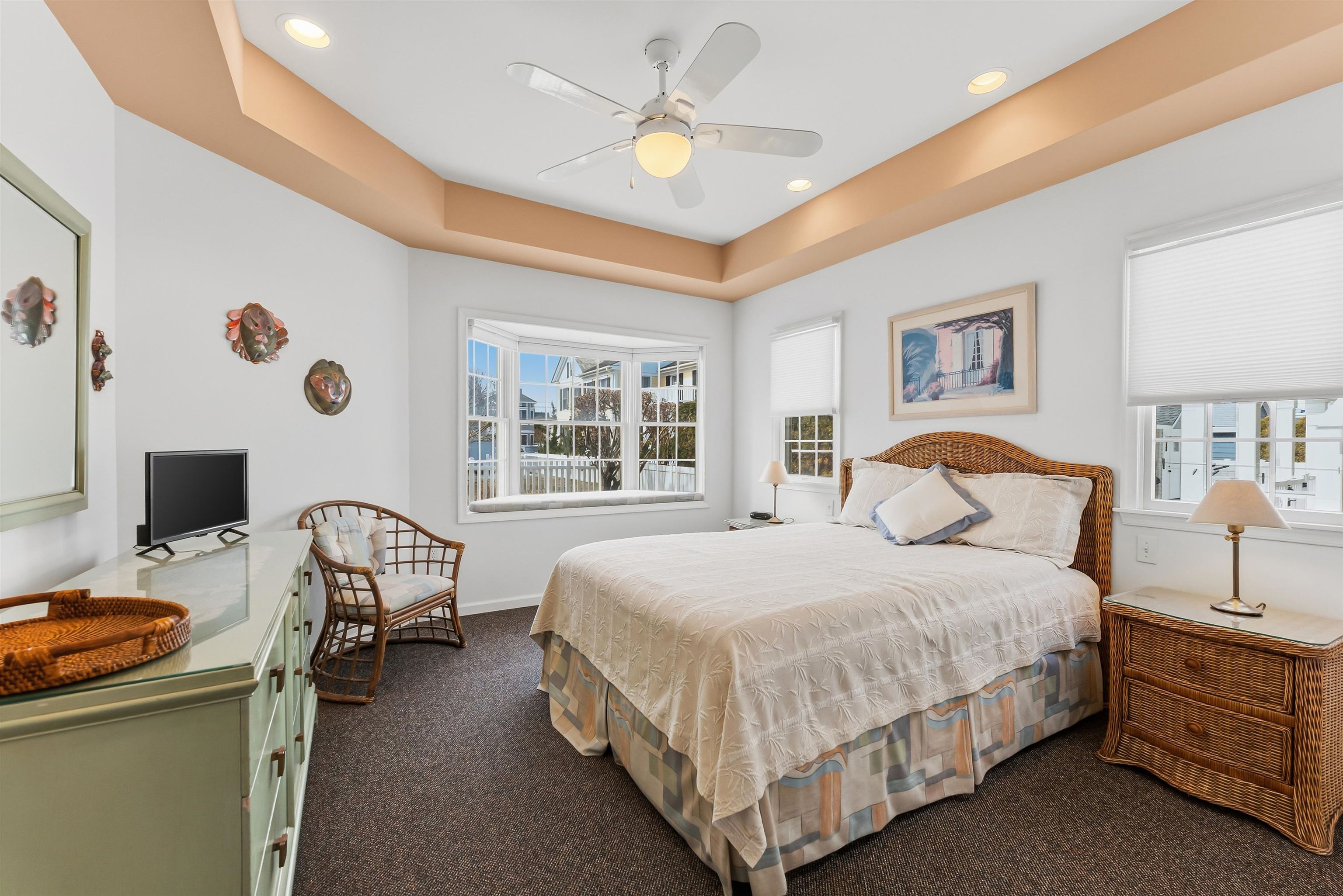 125 98th Street Stone Harbor, NJ 08247 - Photo 31 of 42 a bedroom with a bed and a chandelier