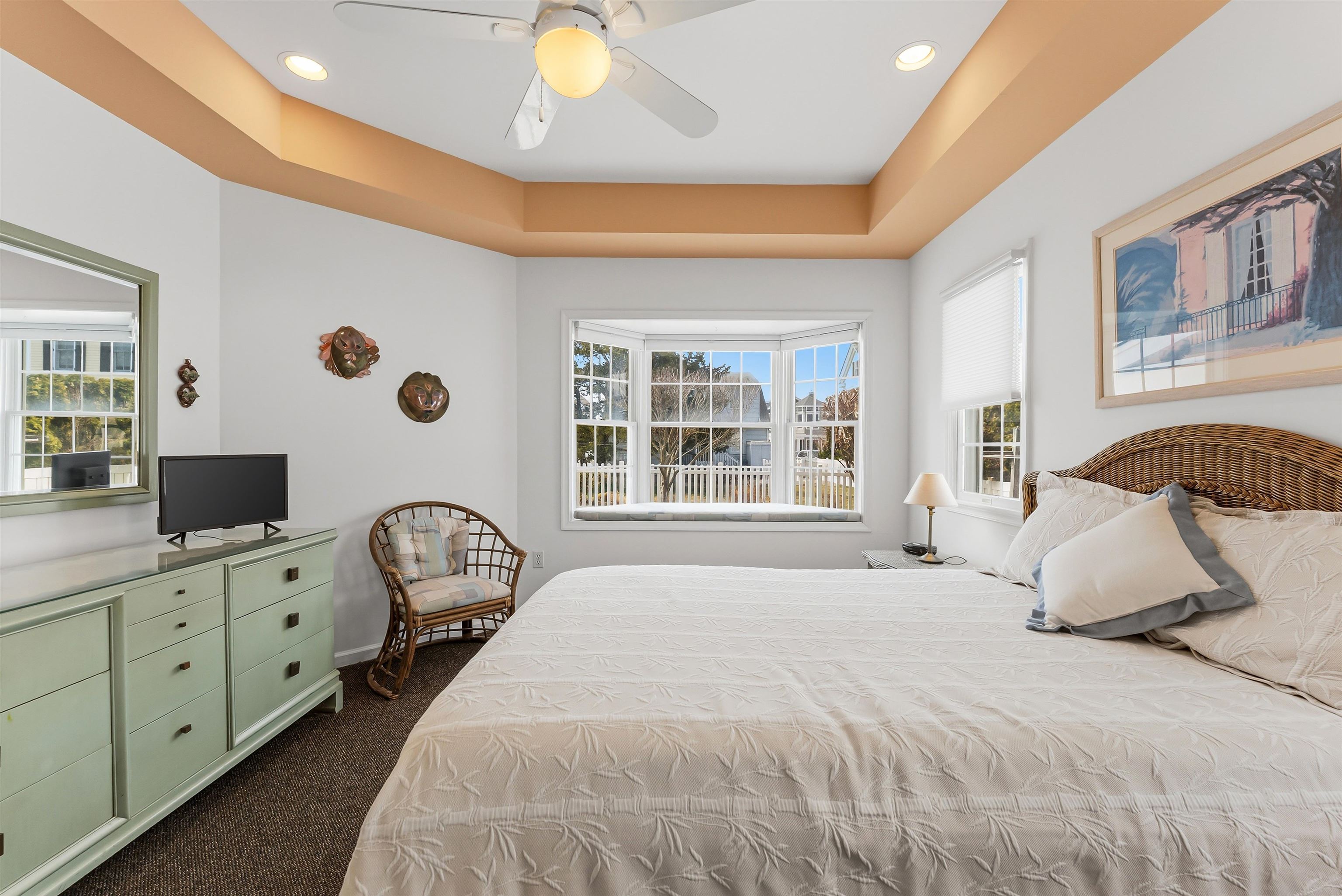125 98th Street Stone Harbor, NJ 08247 - Photo 32 of 42 a bedroom with a bed and a large window