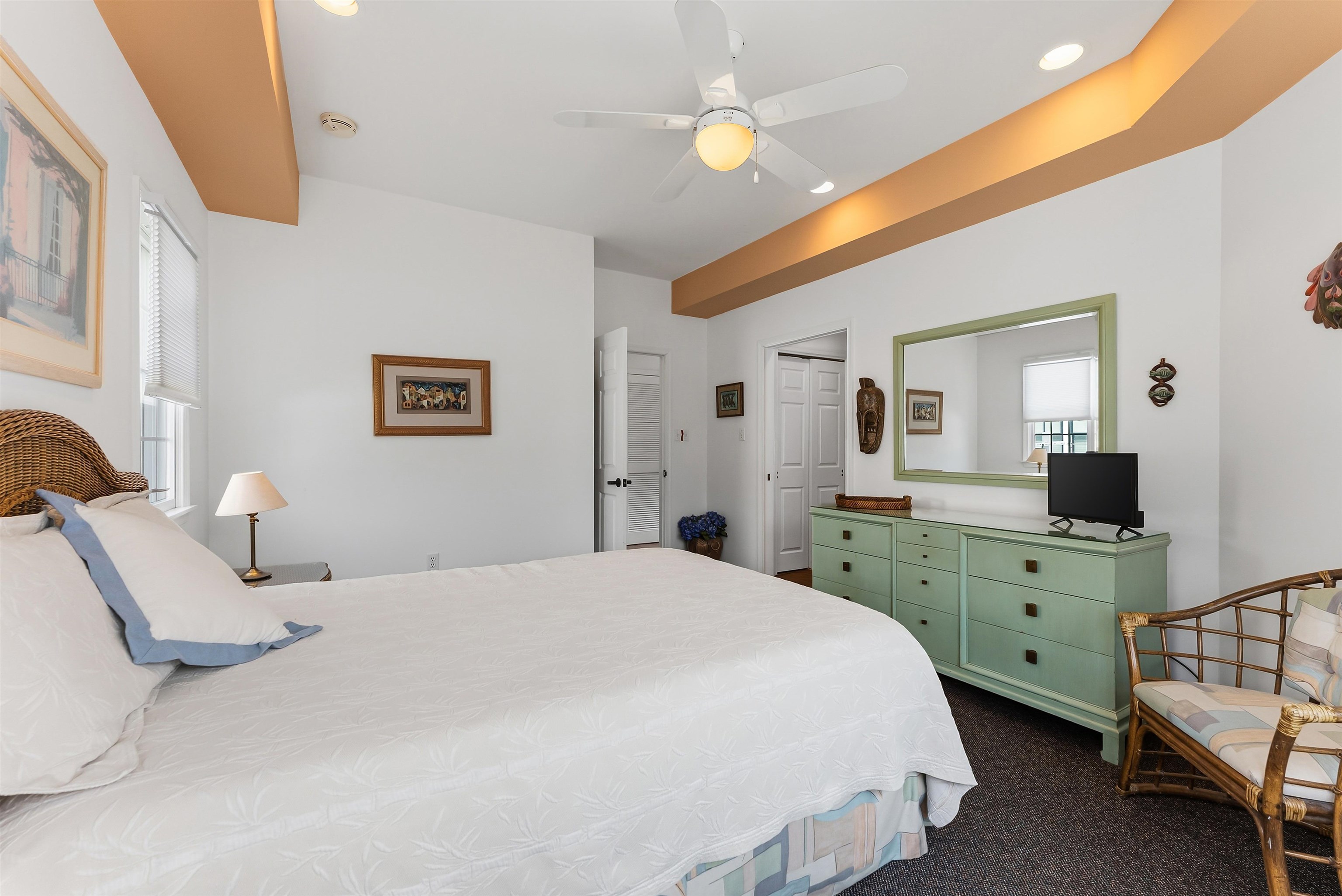 125 98th Street Stone Harbor, NJ 08247 - Photo 33 of 42 a spacious bedroom with a bed and a view of bathroom