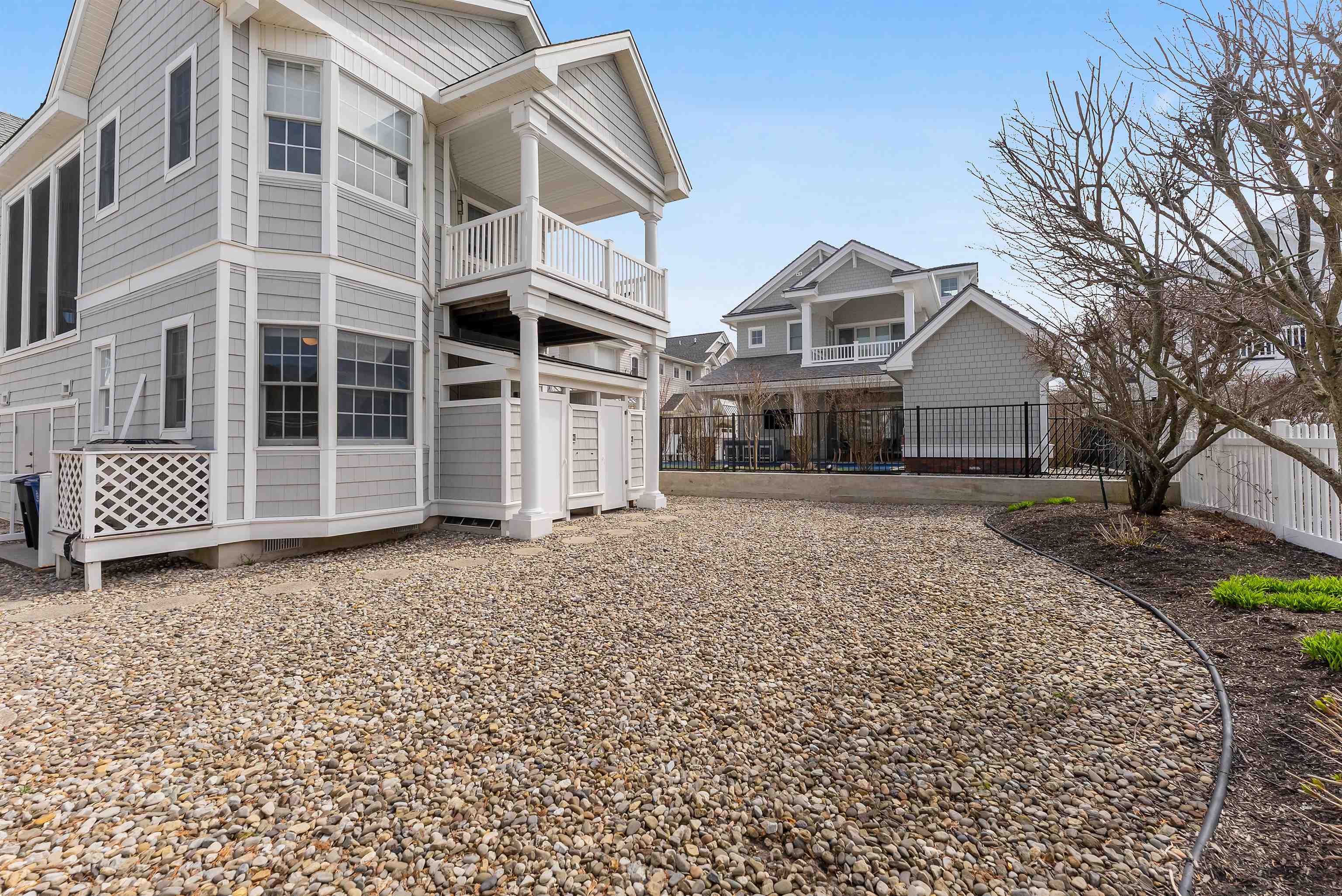 125 98th Street Stone Harbor, NJ 08247 - Photo 38 of 42 a front view of a house with a yard
