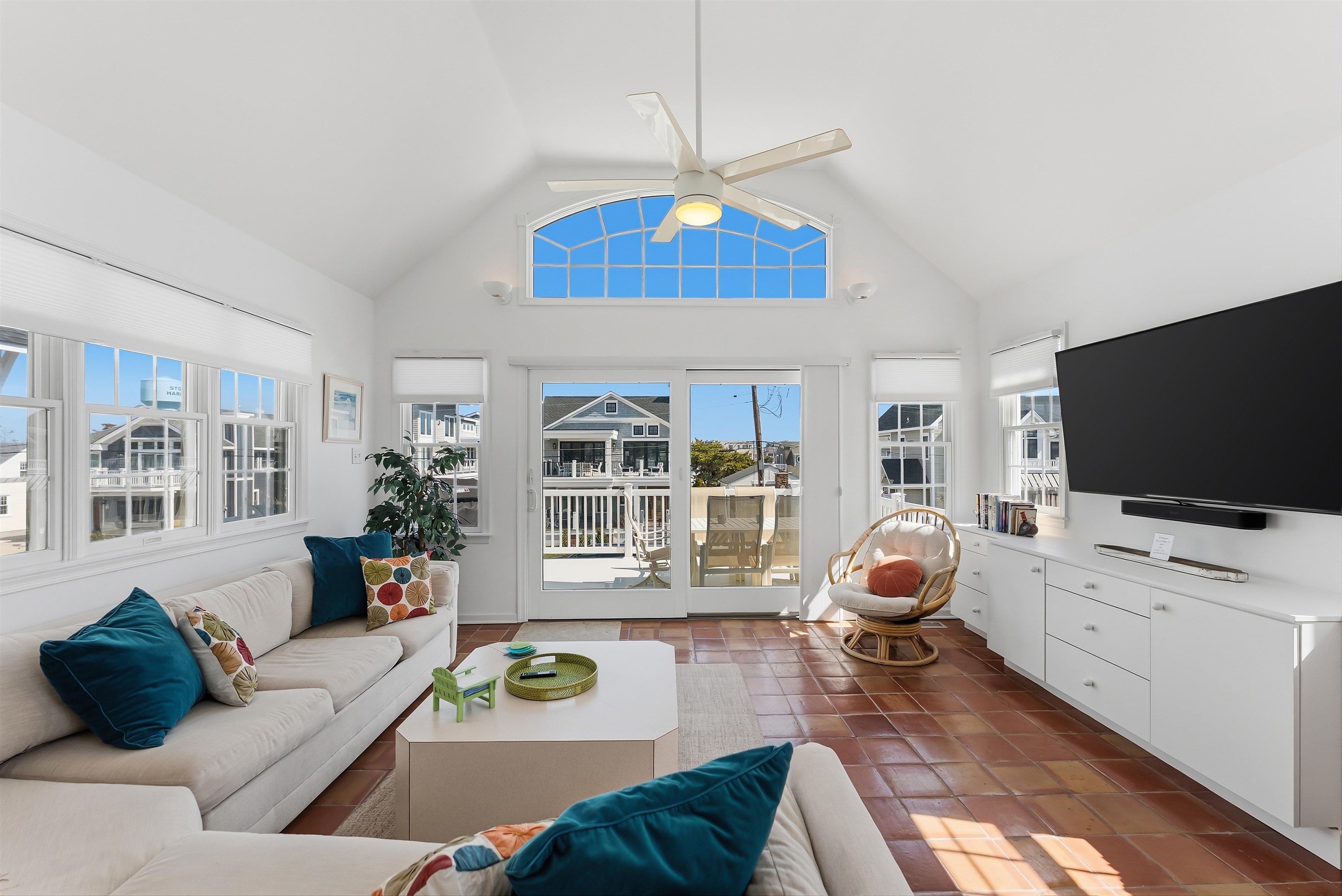 125 98th Street Stone Harbor, NJ 08247 - Photo 5 of 42 a living room with furniture and a flat screen tv