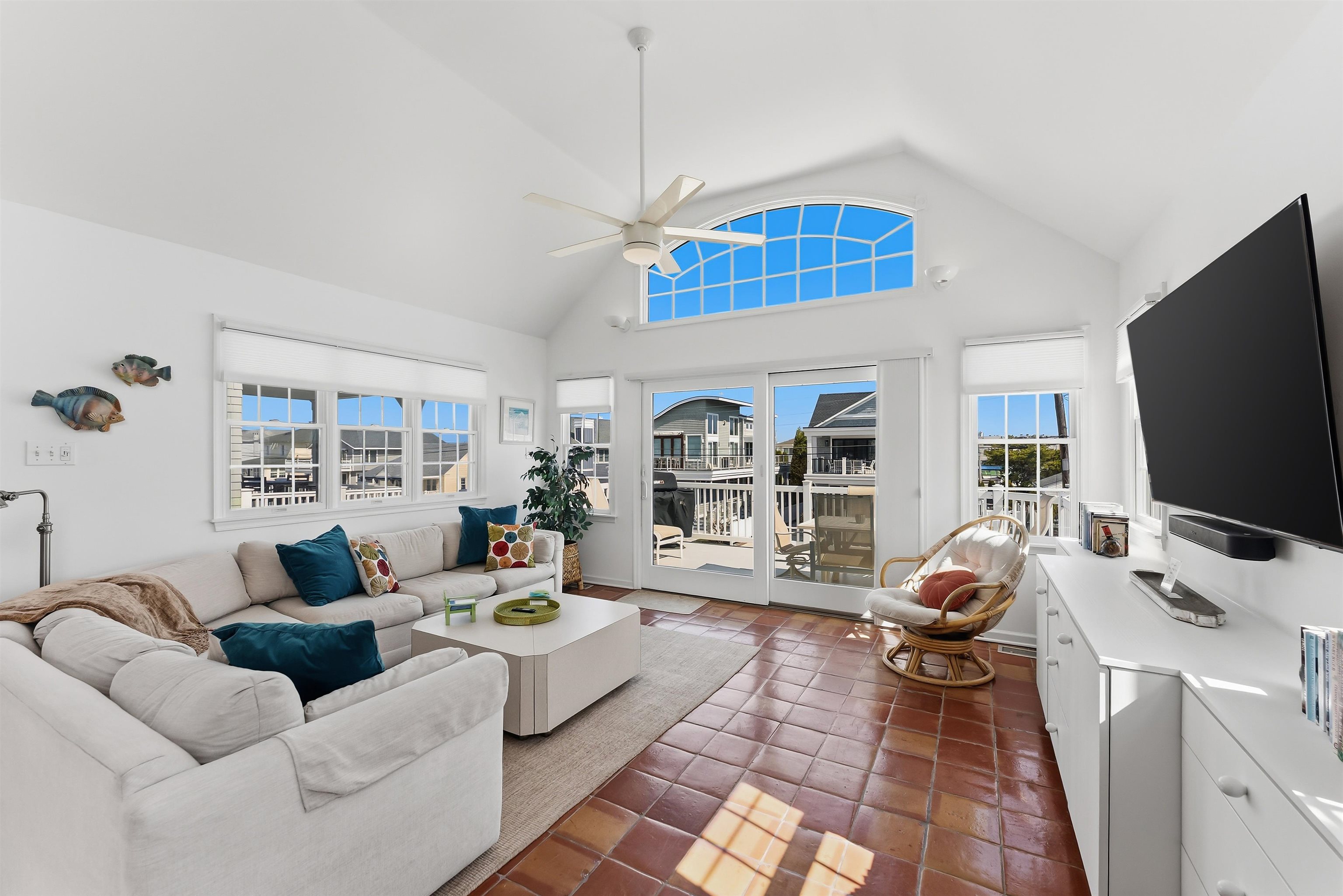 125 98th Street Stone Harbor, NJ 08247 - Photo 7 of 42 a living room with furniture and a flat screen tv