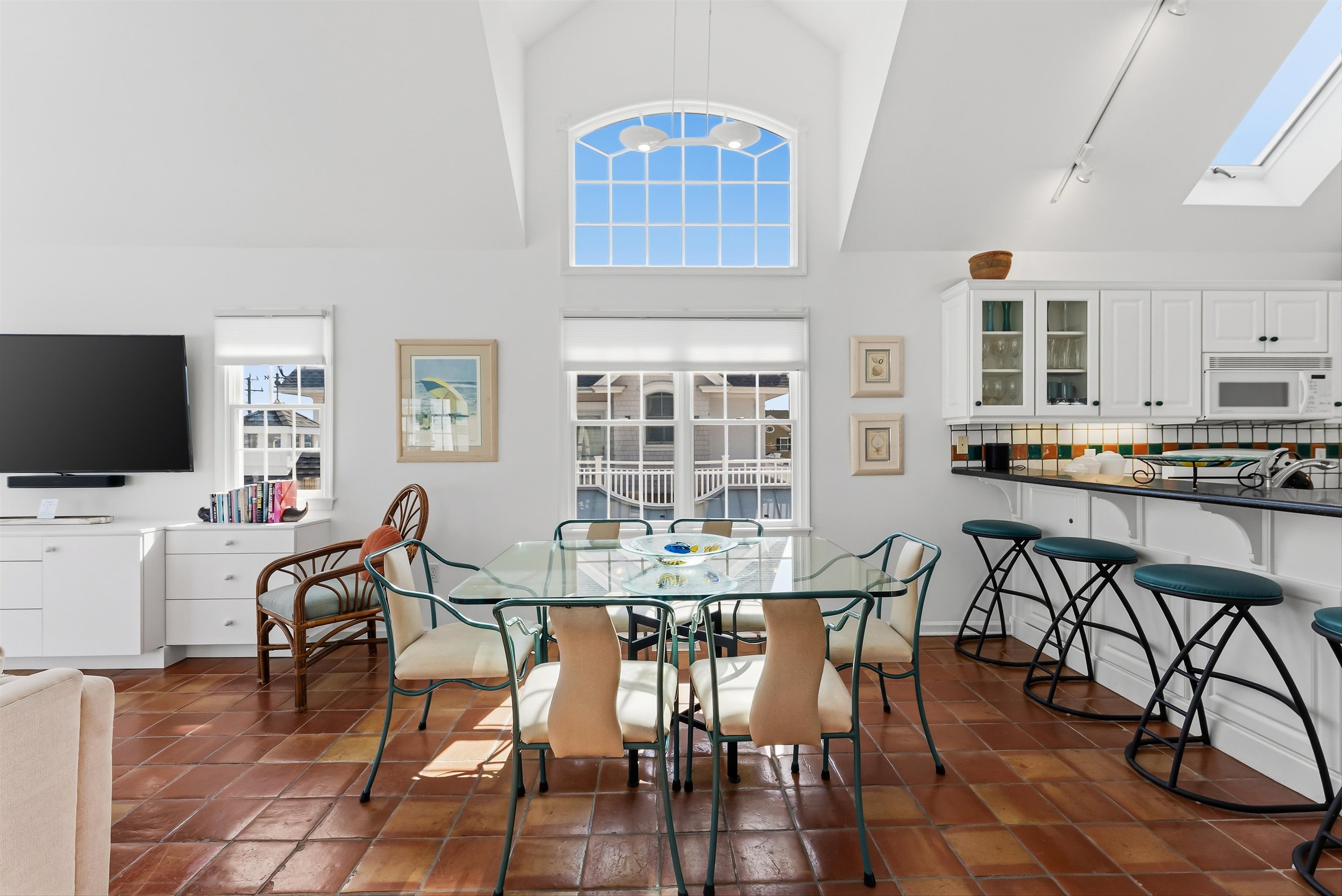 125 98th Street Stone Harbor, NJ 08247 - Photo 9 of 42 a view of a dining room with furniture window and wooden floor