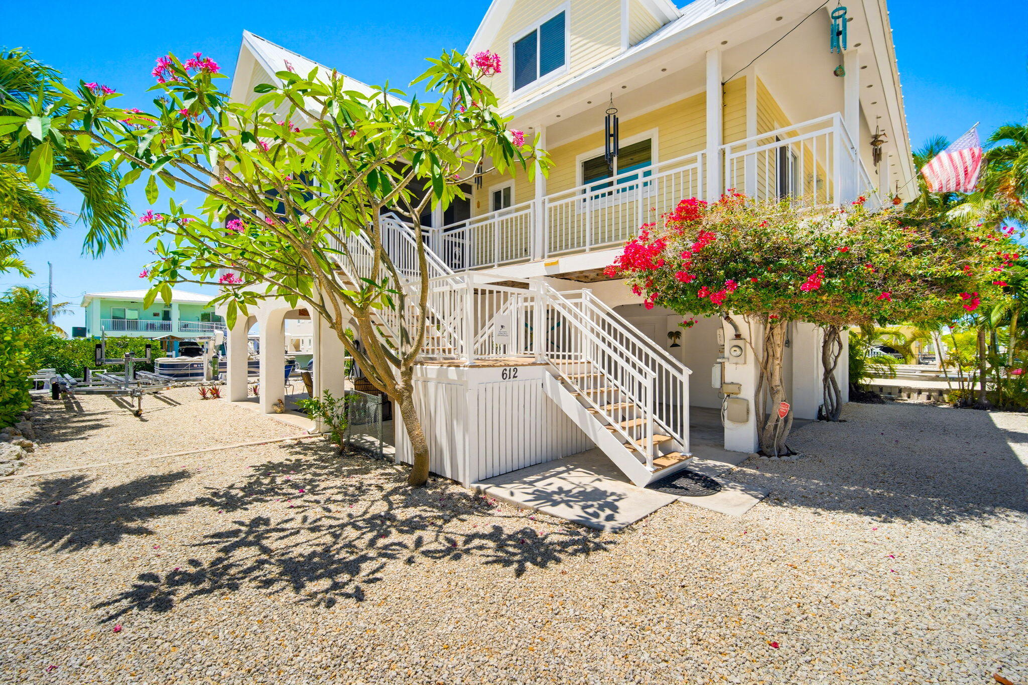 612 Blackbeard Road Summerland Key, FL 33042 - Photo 49 of 68 a view of a potted flower in the front of a building