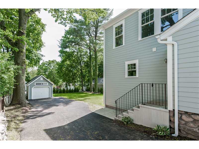 58 Middlesex Road Darien, CT 06820 - Photo 17 of 20 a front view of a house with a garden