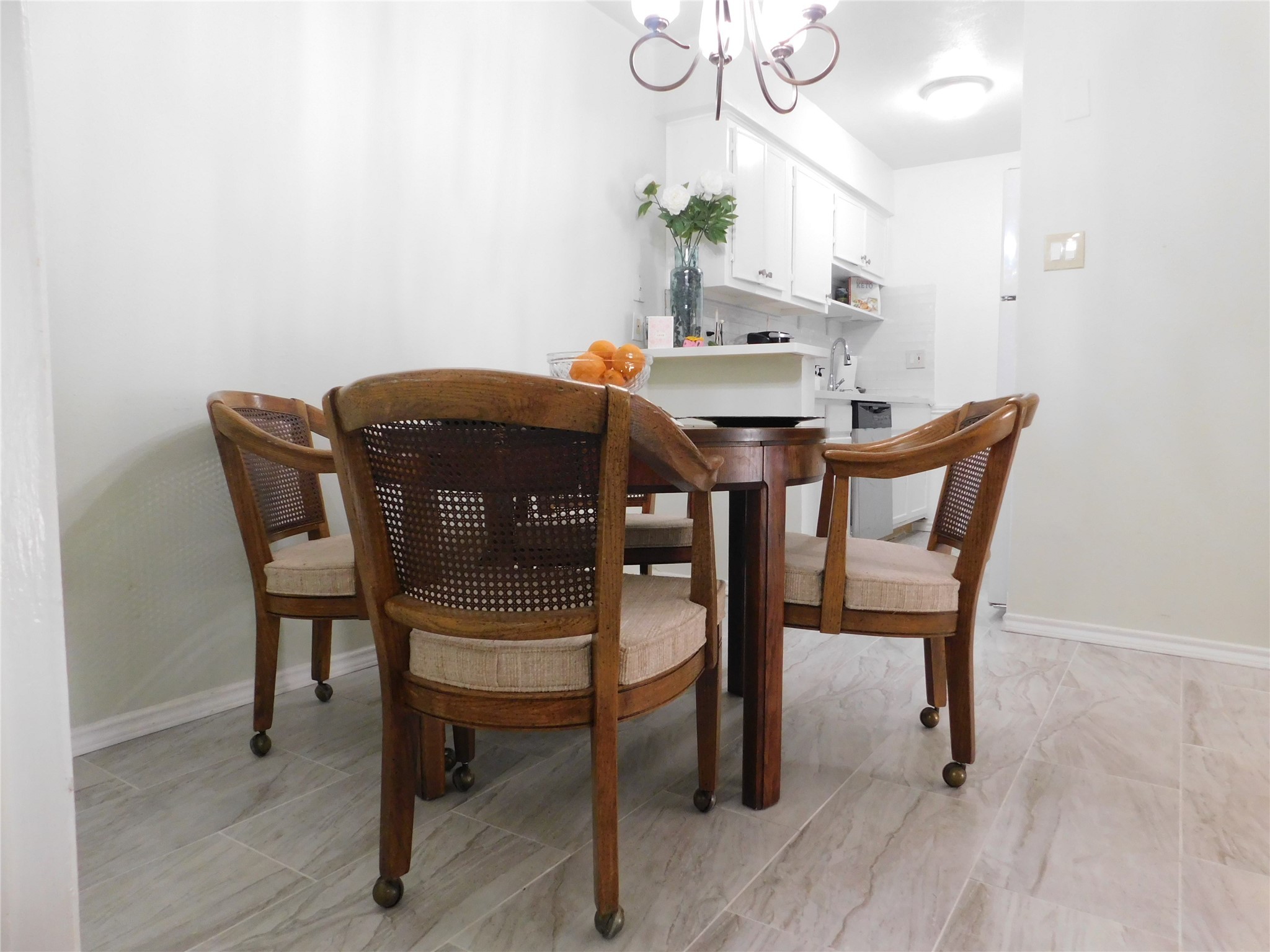 3131 Cummins Street, Unit 46 Houston, TX 77027 - Photo 3 of 8 a view of a dining room with furniture and wooden floor