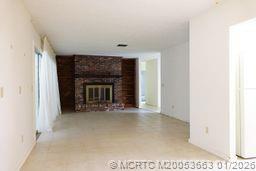 4 Miramar Road Stuart, FL 34996 - Photo 7 of 33 fireplace taken from dining area into living rm