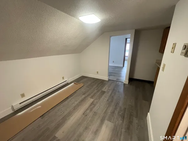 an empty room with wooden floor