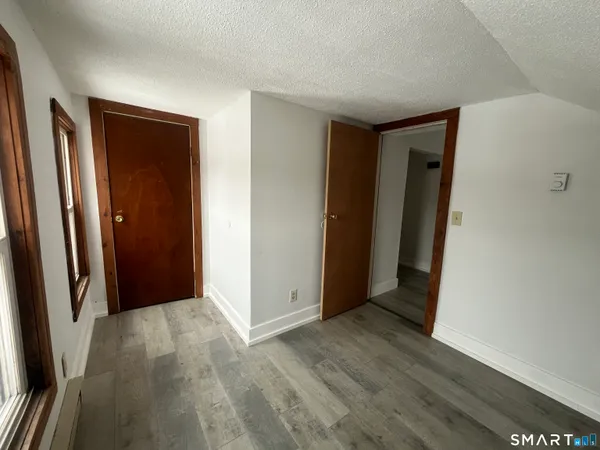 a view of entryway with wooden floor