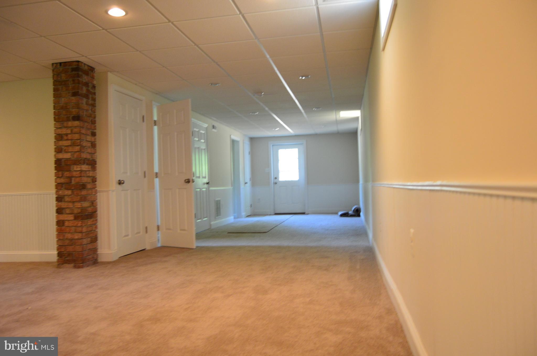 6034 Linden Road St. Leonard, MD 20685 - Photo 16 of 22 a view of an empty room with a window