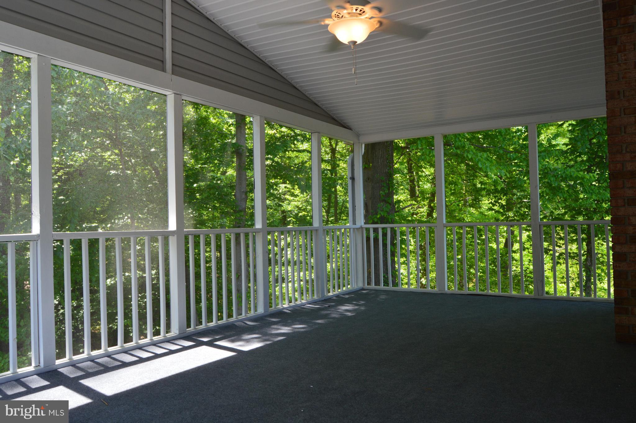 6034 Linden Road St. Leonard, MD 20685 - Photo 18 of 22 a view of a porch with a yard