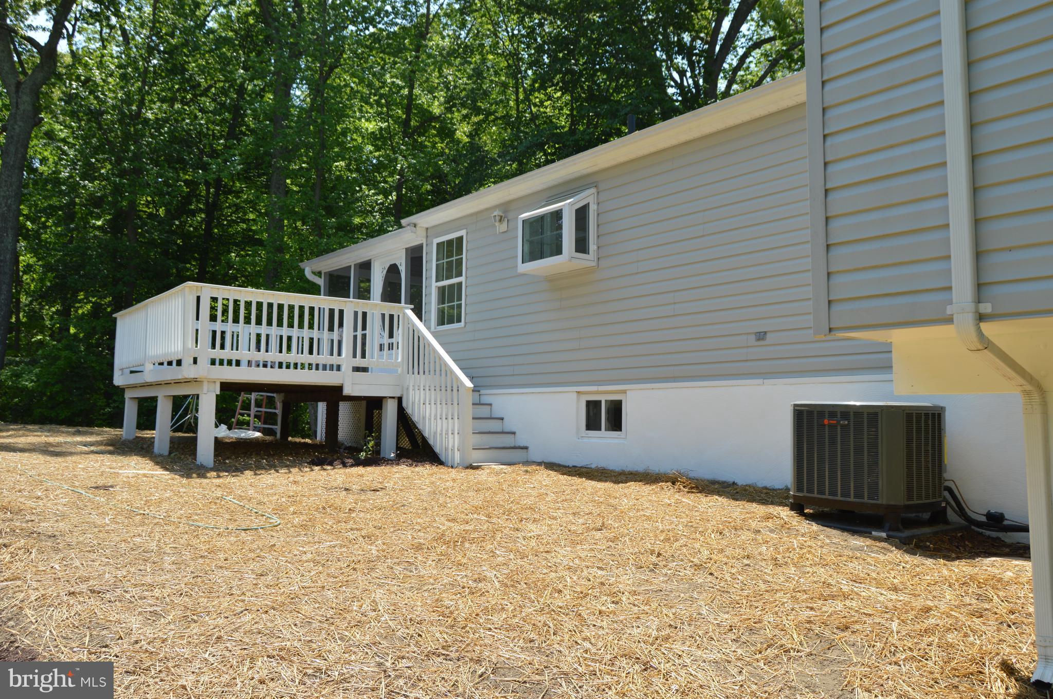6034 Linden Road St. Leonard, MD 20685 - Photo 21 of 22 a view of a house with a roof deck
