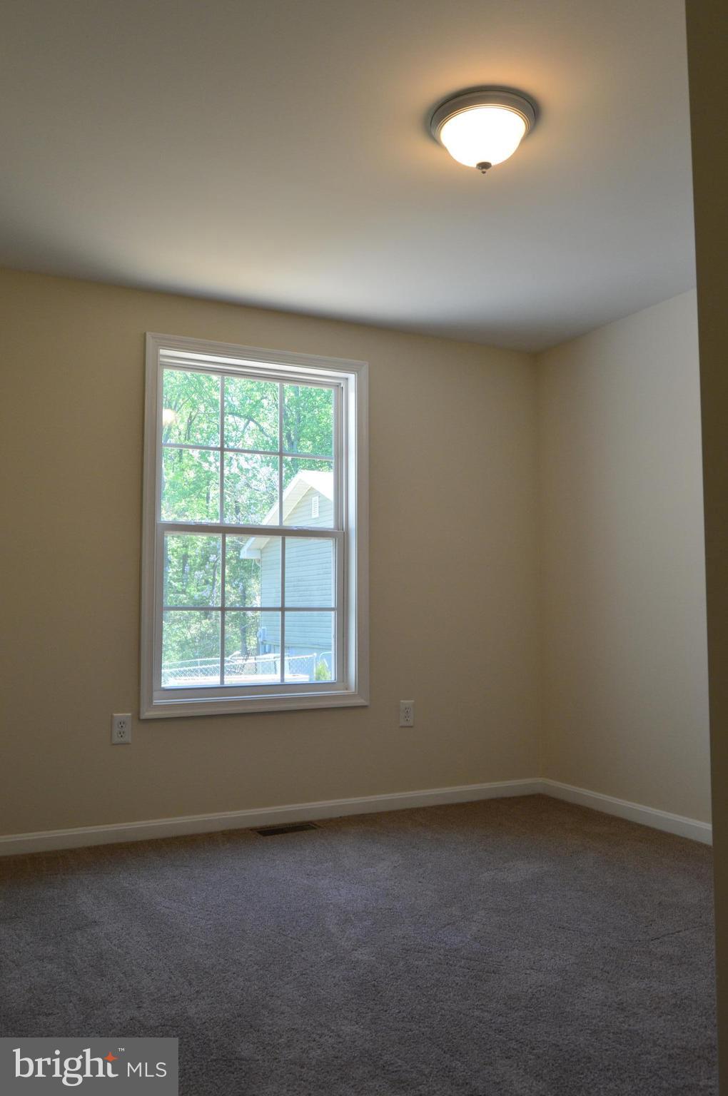 6034 Linden Road St. Leonard, MD 20685 - Photo 10 of 22 an empty room with a window