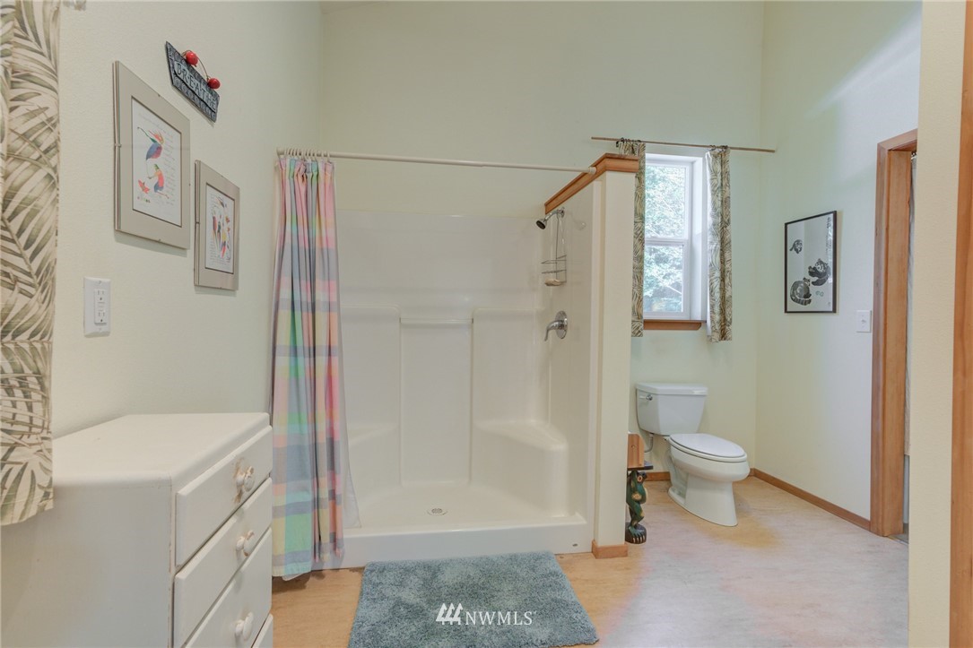 7565 Bear Ridge Way Maple Falls, WA 98266 - Photo 14 of 25 a bathroom with a sink a toilet and shower
