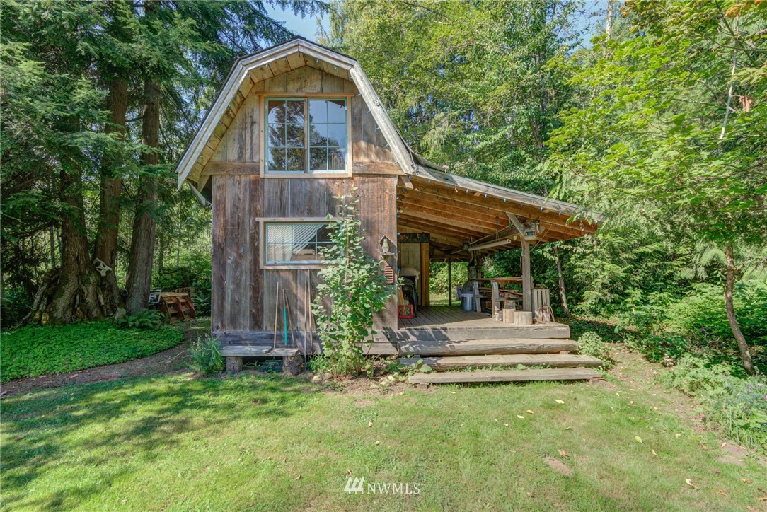 7565 Bear Ridge Way Maple Falls, WA 98266 - Photo 15 of 25 a front view of a house with a yard