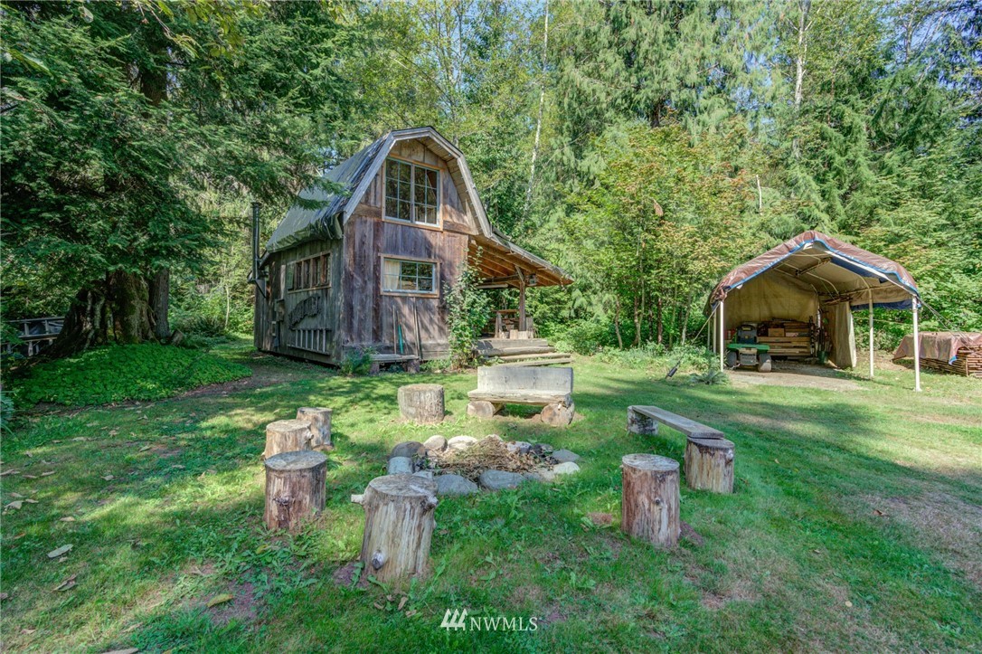 7565 Bear Ridge Way Maple Falls, WA 98266 - Photo 19 of 25 a front view of a house with garden